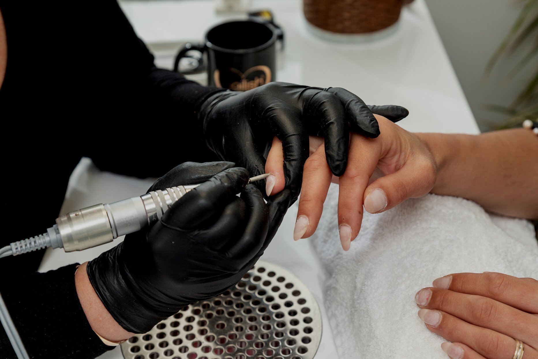 Nail artist working on nail